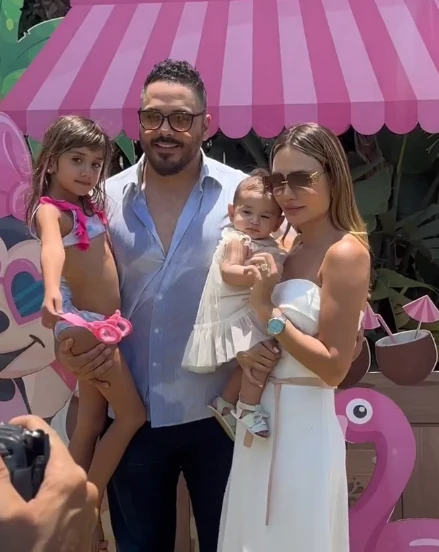 A family at a tropical themed celebration